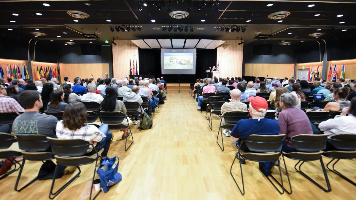 Audience views a presentation in the International Ballroom